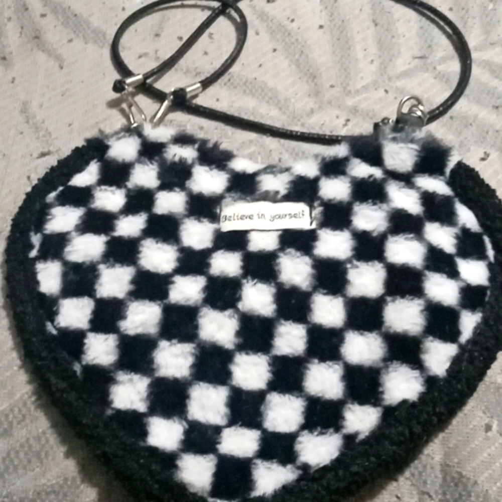 Cute heart shaped furry purse black and white checkered.